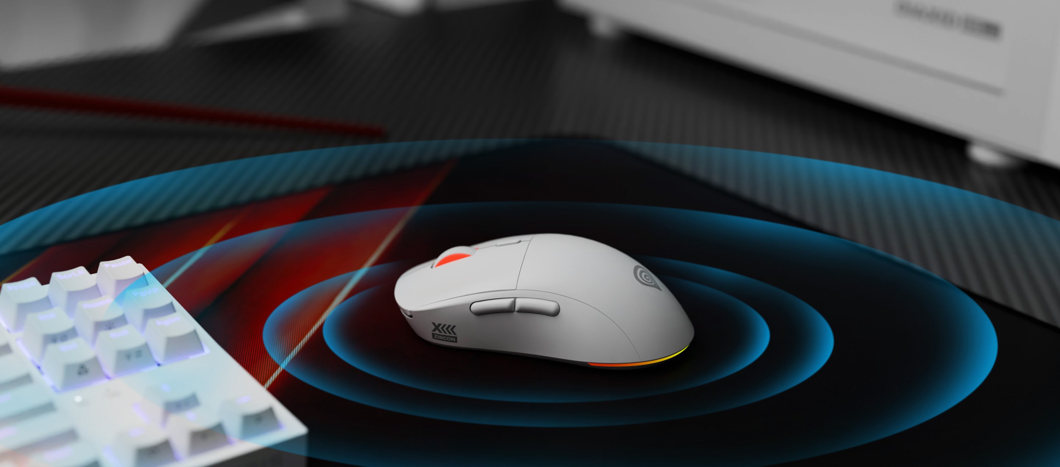 Бездротова ігрова миша Genesis Zircon XIII з функціями, що налаштовуються, і роздільною здатністю 26000 DPI, розміщена на ігровому килимку
