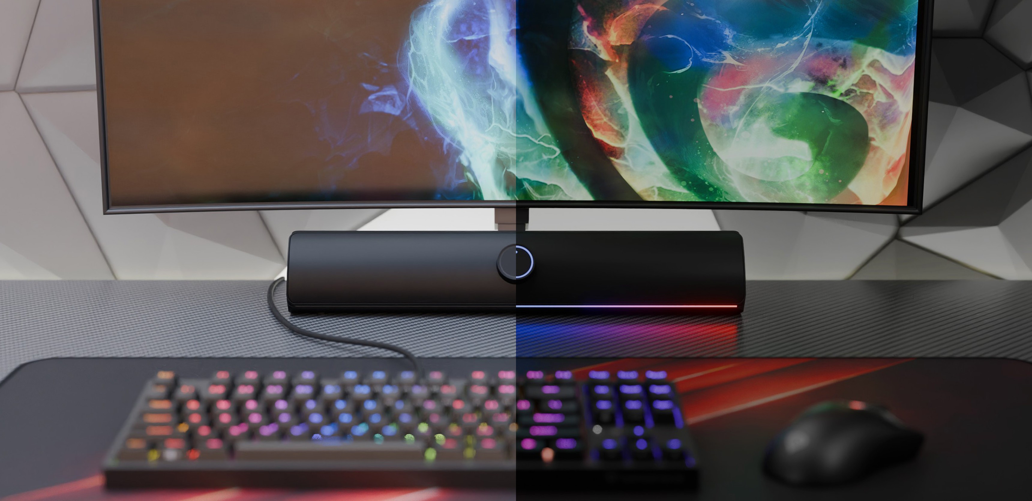 Чорна Bluetooth-саундбар, розміщена під кольоровим монітором, з ігровою RGB-клавіатурою та мишею на робочому столі